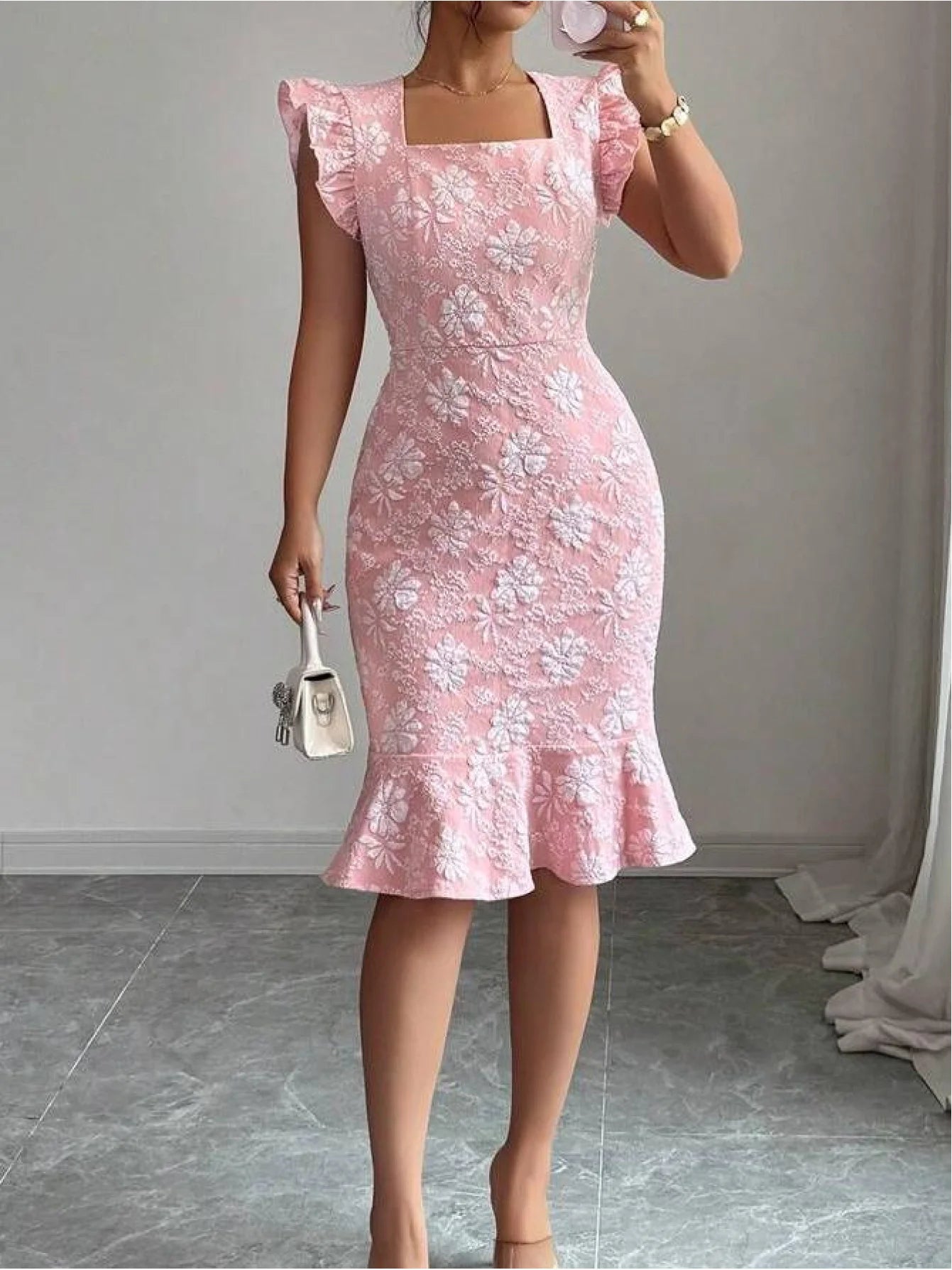 A lady’s elegant floral-print maxi dress with a single shoulder strap, wide puff sleeves, gathered waistline, and a spring/fall